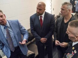WWE CEO Vince McMahon, Paul "Triple H" Levesque, and Shane McMahon speak to Army Command Sgt. Maj. John W. Troxell.