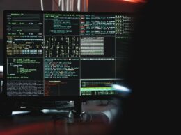 Close up view of system hacking in computer monitors.