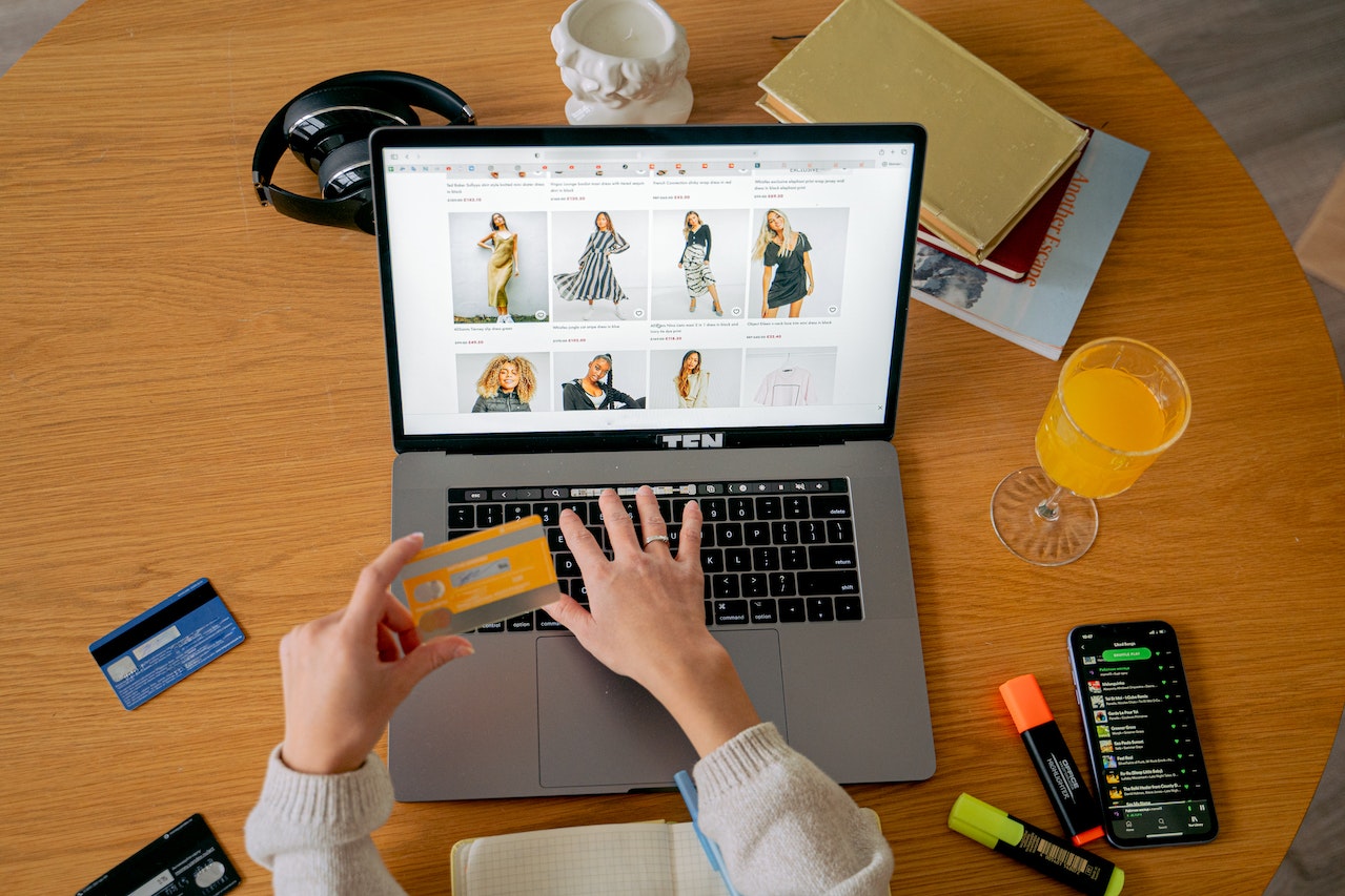 Woman shopping online using a credit card