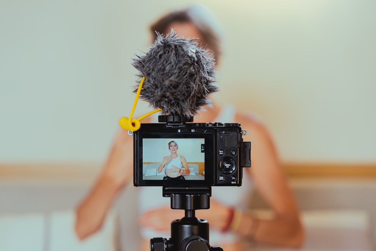 Shallow focus photo of a vlogger woman