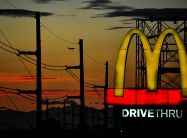Sunset behind McDonald's golden arch
