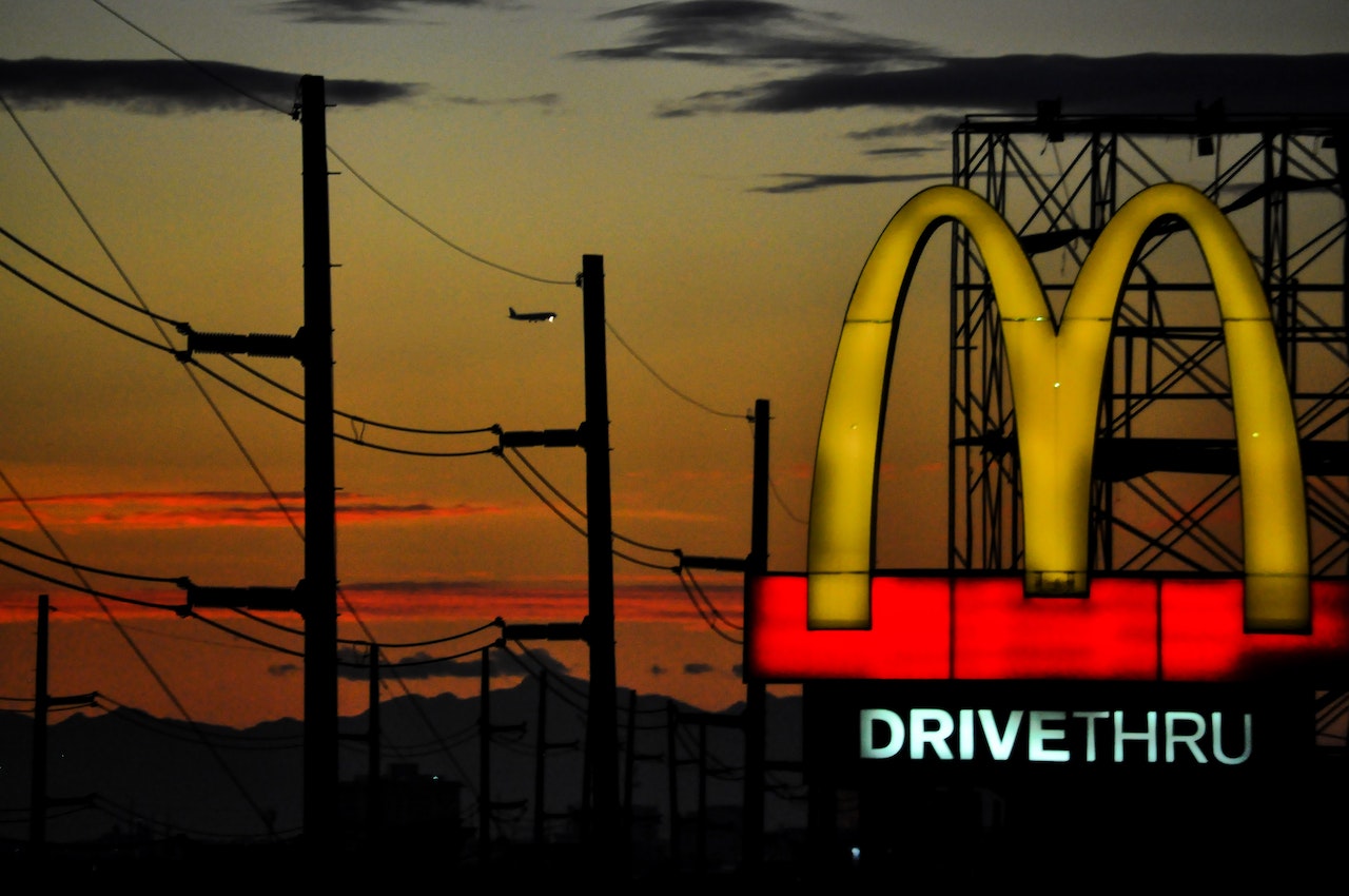 Sunset behind McDonald's golden arch