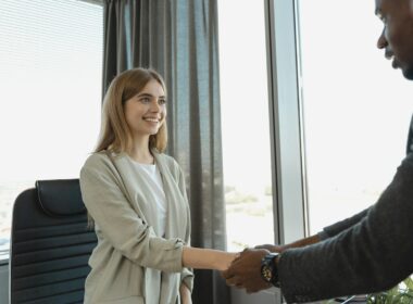 Young women shaking hands with man for a job interview