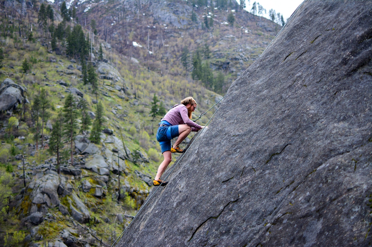 Man climbing rock mountain