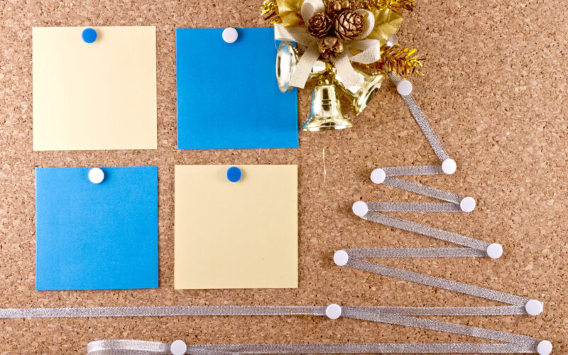 New Year's resolutions corkboard with sticky notes