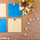 New Year's resolutions corkboard with sticky notes