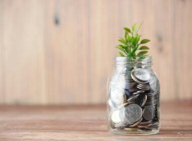 Image of money growing in a jar in an Image by Unsplash