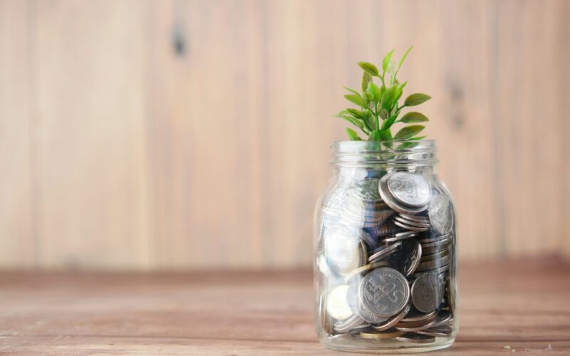 Image of money growing in a jar in an Image by Unsplash