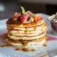 Pancakes-with-strawberries-and-caramel-syrup-in-Image-by-Pexels