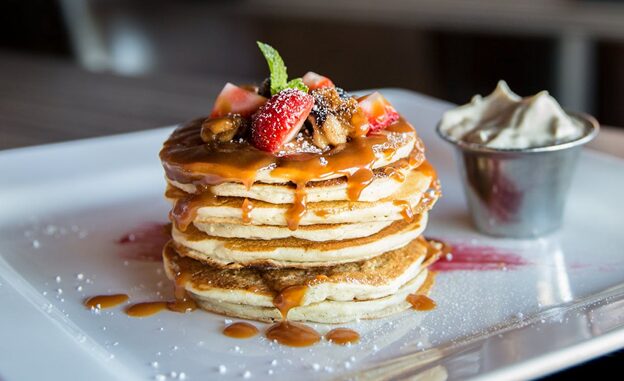 Pancakes-with-strawberries-and-caramel-syrup-in-Image-by-Pexels