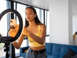 Young woman preparing a TikTok video in an Image by Freepik