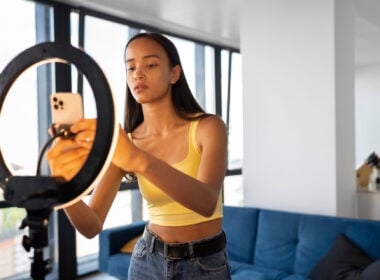 Young woman preparing a TikTok video in an Image by Freepik